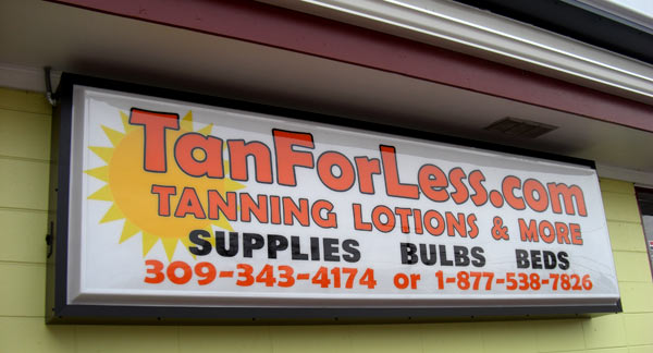 TanForLess sign